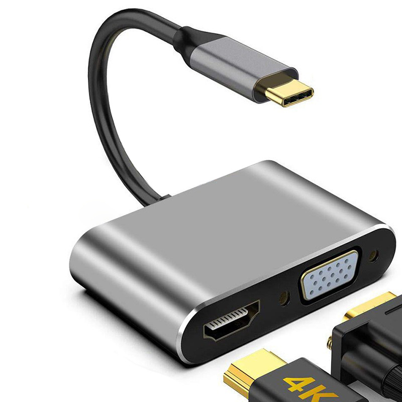 Ein grauer USB-C-Adapter mit HDMI-, VGA- und einem weiteren Anschluss.