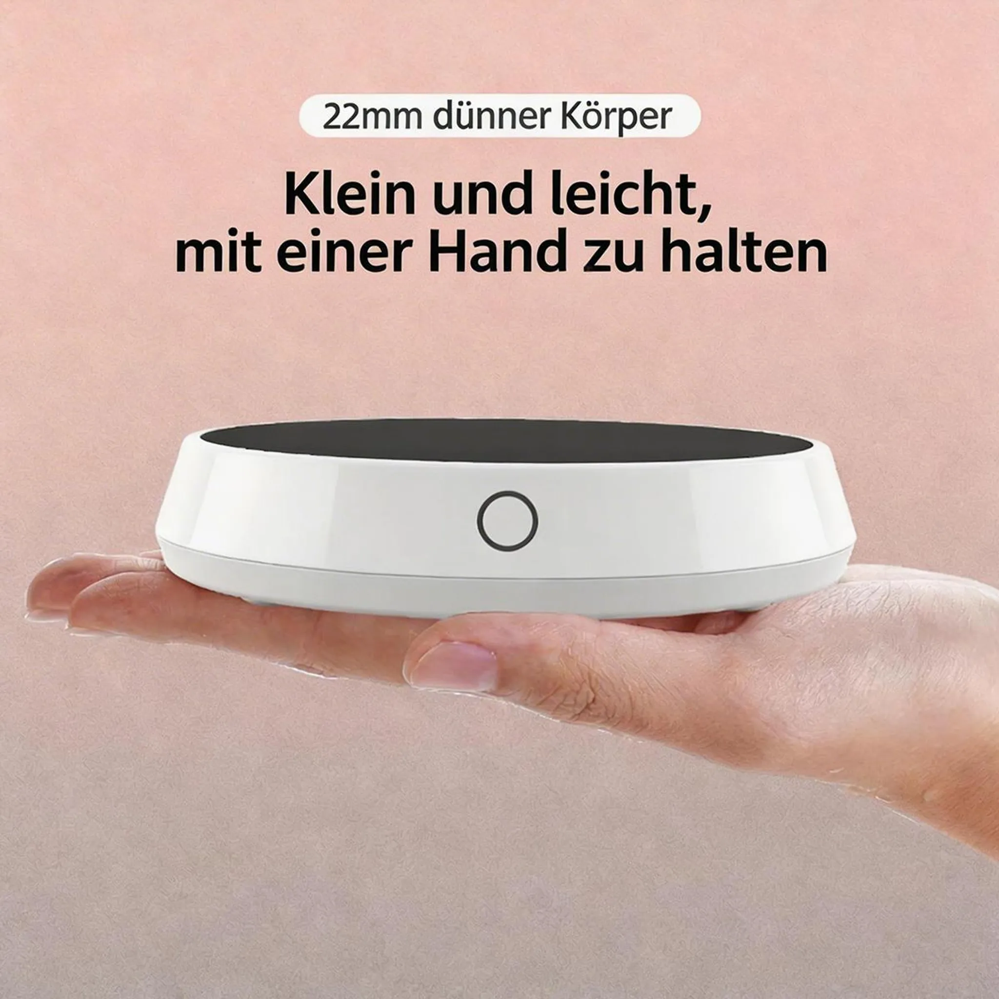 Eine Hand hält ein dünnes, weißes, rundes Gerät mit einem schwarzen Kreis in der Mitte.