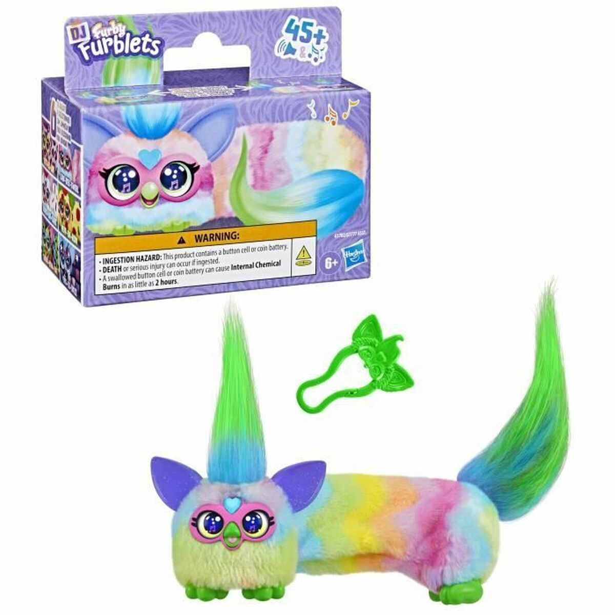 Ein regenbogenfarbenes Furblet-Spielzeug mit lila Karton, grünem Zubehör und Warnhinweis.