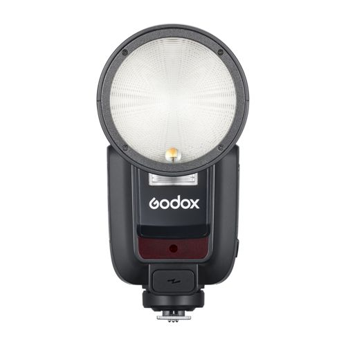 Un flash Godox noir avec diffuseur rond et voyant rouge.