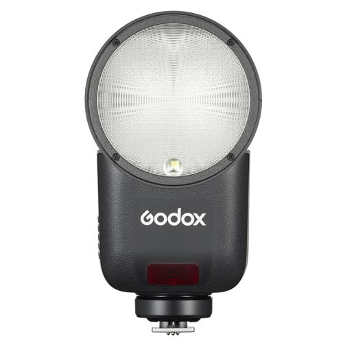 Ein schwarzer Godox-Kamerablitz mit rundem, mattem Lichtdiffusor und roter Kontrollleuchte.