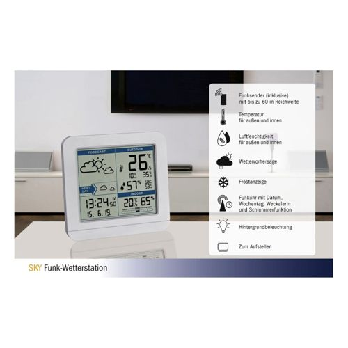 Eine weiße Wetterstation zeigt Außen- und Innentemperatur, Luftfeuchtigkeit, Datum und Uhrzeit.