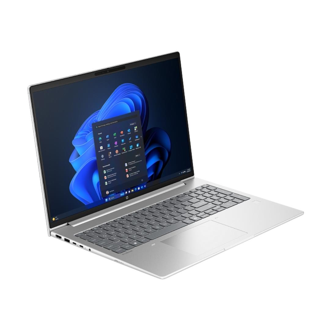 Windows 11 gösteren açık ekranlı gümüş rengi dizüstü bilgisayar.