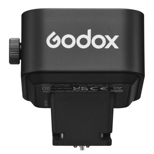 Zwarte Godox flitser met wit logo en instelknop, onderkant met details.