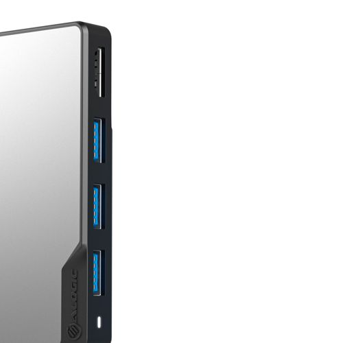 Un dispositivo nero con più porte USB blu e finitura a specchio argentata.