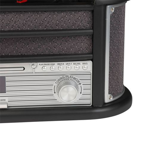 Close-up van een stereo-installatie met knoppen voor afspelen, stoppen, afstemmen en modus.