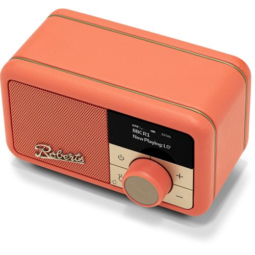 Una radio retrò color corallo con finiture dorate e schermo LCD.
