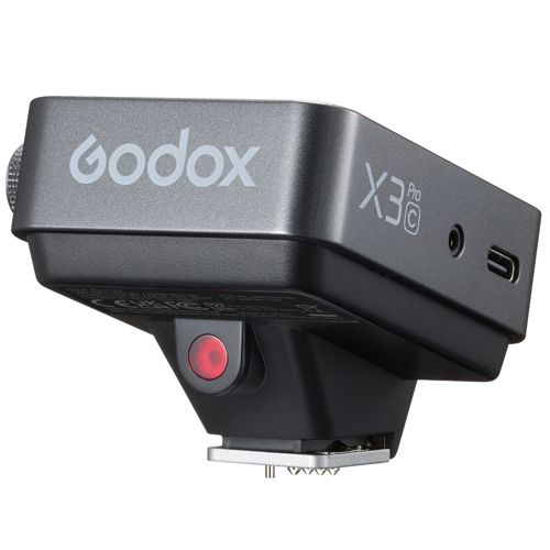 Grijze Godox X3 Pro transmitter met rode knop en USB-C poort.