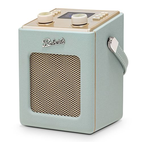 Una radio Roberts verde chiaro con pannello di controllo dorato e maniglia.