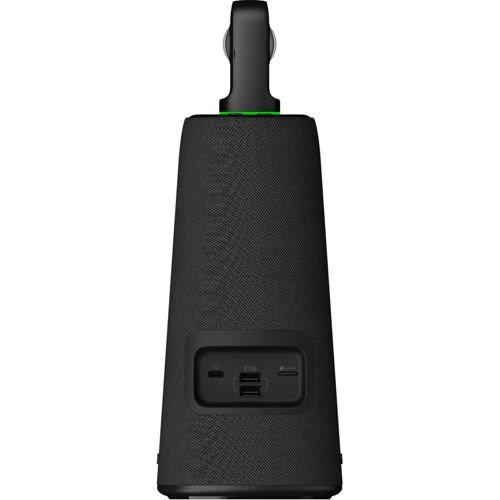 Schwarzer Lautsprecher mit Griff und USB-Anschlüssen, grün leuchtende Oberseite.