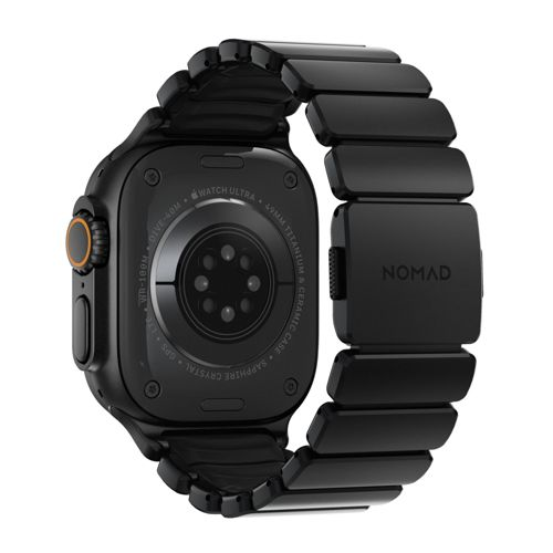 Schwarze Smartwatch mit Metallarmband und sichtbarem Herzfrequenzsensor auf der Rückseite.