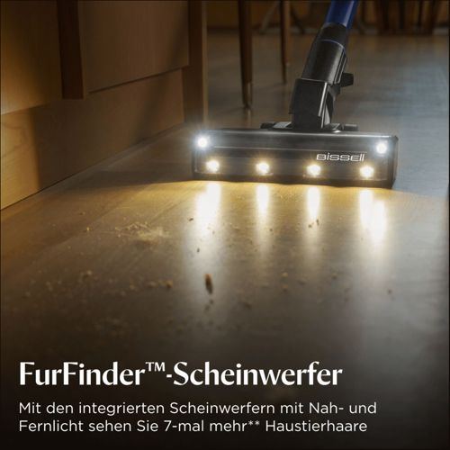 Un aspirapolvere Bissell con luci brillanti pulisce un pavimento in legno.