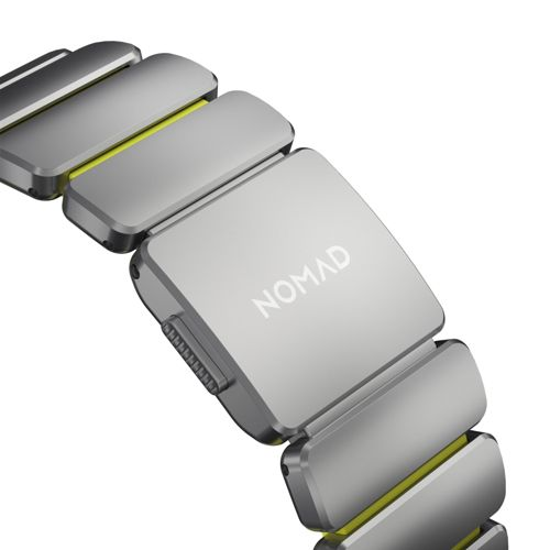 Graues Nomad-Uhrenarmband mit gelben Akzenten und Schnallenverschluss.