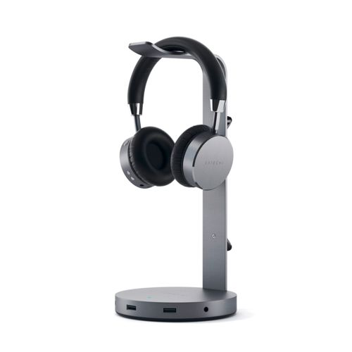 Cuffie grigie con archetto nero su supporto grigio con porte USB.