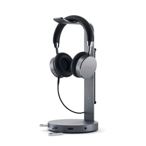 Supporto grigio per cuffie con cuffie nere e argento.