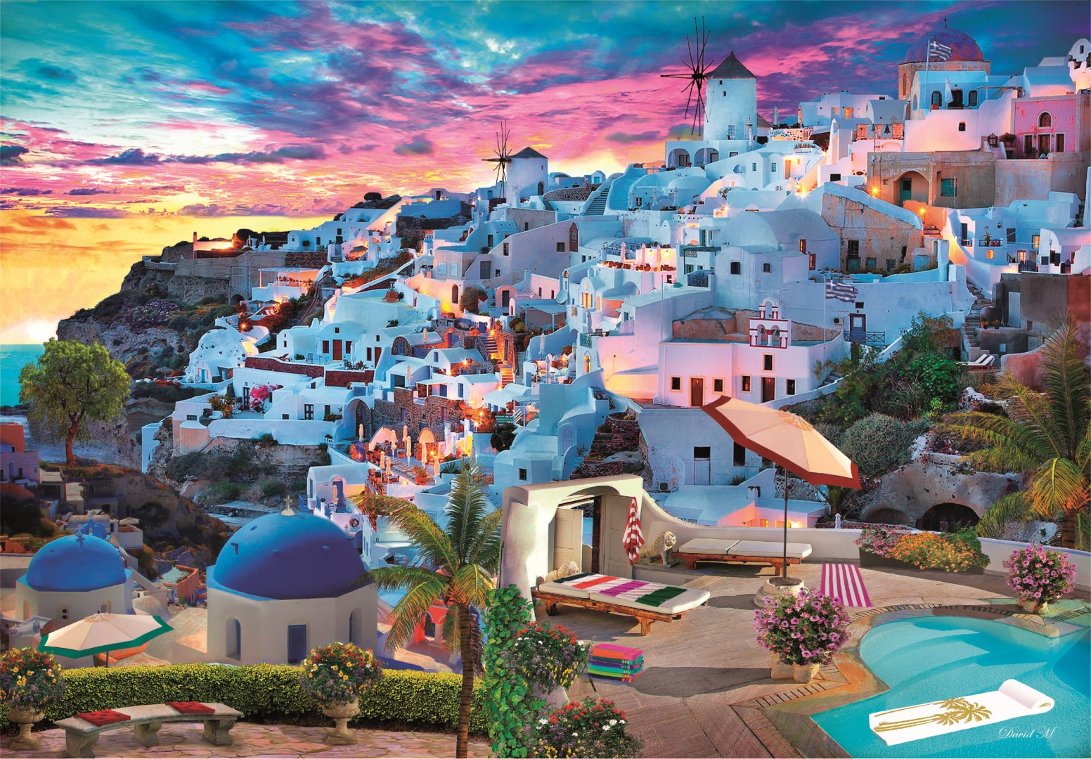 Edificios blancos en una ladera con molinos y un cielo de atardecer colorido.