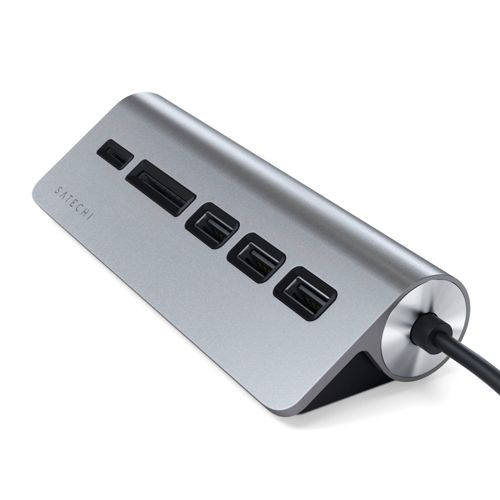 Un concentrador USB-C plateado con varios puertos, incluyendo USB-A y ranuras para tarjetas SD.