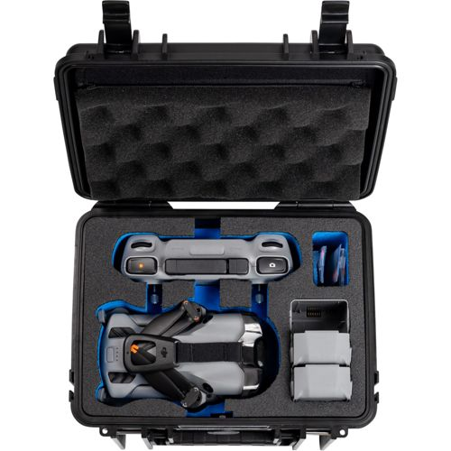 Un set drone grigio con telecomando, batterie e accessori in una custodia nera.