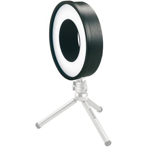 Ein schwarzer Ringlicht auf einem kleinen silbernen Stativ.