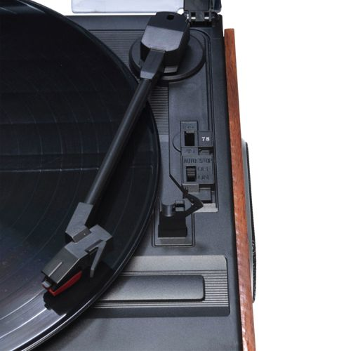 Close-up of a turntable with a black vinyl record and tonearm.