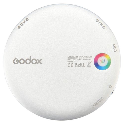 Runde weiße Godox-Leuchte mit Beschriftungen für DIM, FNO, MOD, USB/MIC und RGB-Licht.