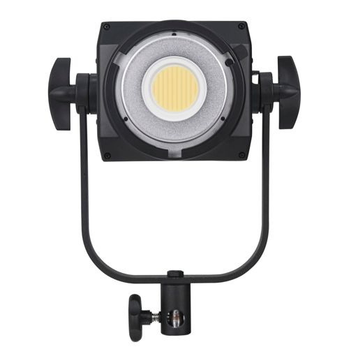 Ein schwarzes LED-Licht mit silbernem Ring und gelber Mitte, montiert auf einem Bügel.