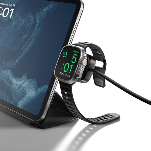 Un tablet con un supporto di ricarica per smartwatch che tiene uno smartwatch.
