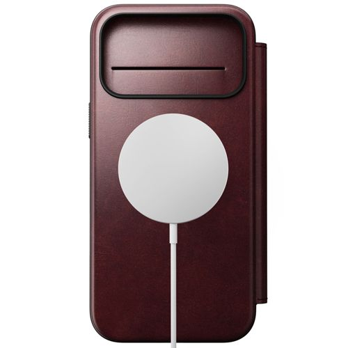 Custodia per telefono rosso scuro con piastra di ricarica bianca e cavo.