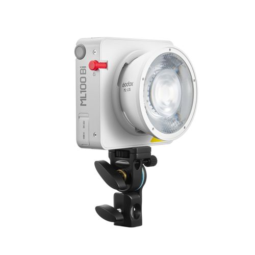 Une lumière LED Godox ML100Bi blanche avec bouton rouge et support est montrée sur fond blanc.