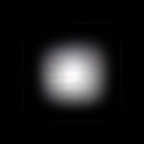 Ein heller Lichtfleck auf schwarzem Hintergrund.