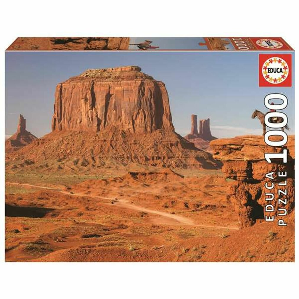 Paisaje desértico de Monument Valley con formaciones rocosas y un caballo.