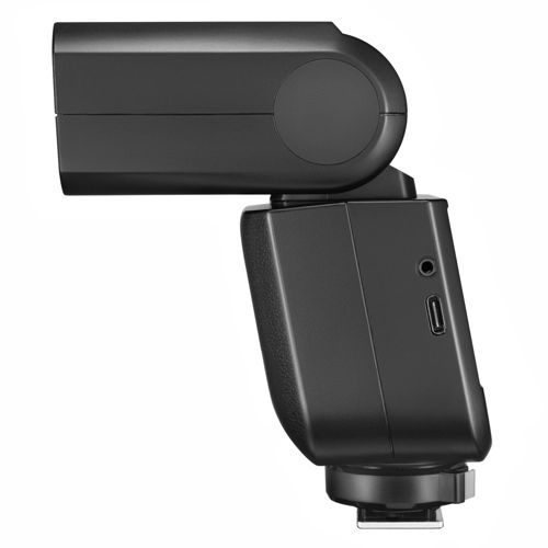 Flash d'appareil photo noir vu de côté, avec ports USB et casque.