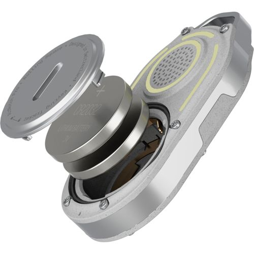 A key tracker with its battery compartment open, showing coin cell batteries.