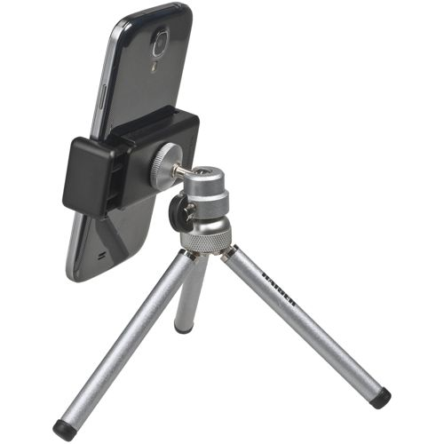 Ein schwarzes Smartphone ist auf einem silbernen Mini-Stativ mit verstellbaren Beinen montiert.