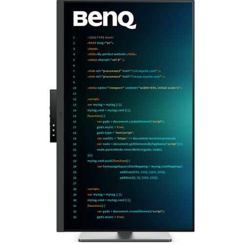 A BenQ monitor displays code on a dark, blue background.