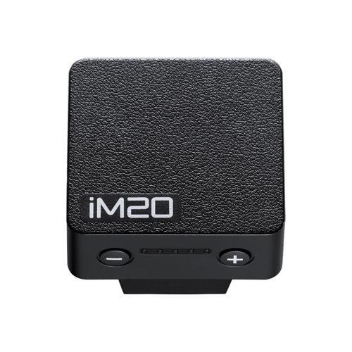 Un appareil noir texturé étiqueté "iM20" avec des boutons plus et moins.
