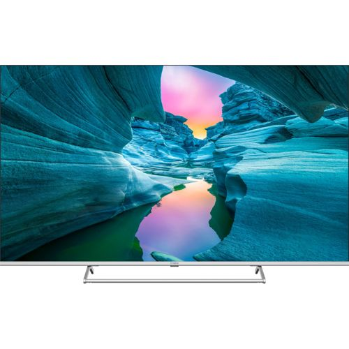 Una TV moderna mostra un canyon con acqua blu e un cielo colorato.