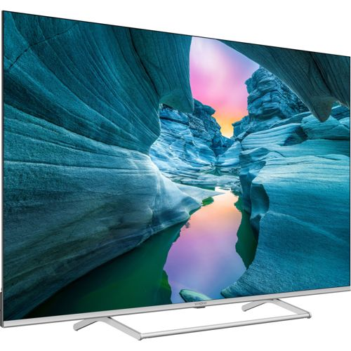 Una TV moderna a schermo piatto mostra un paesaggio di canyon al tramonto.