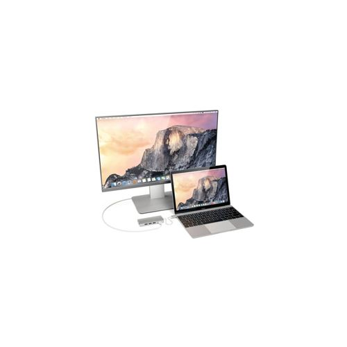 Ein Laptop ist mit einem großen Monitor und einem USB-Hub verbunden.