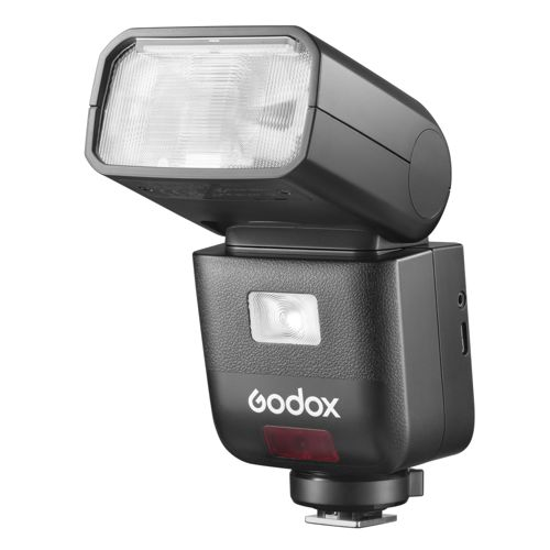 Flash Godox noir avec lampe verticale et lumière de flash. Fond blanc.