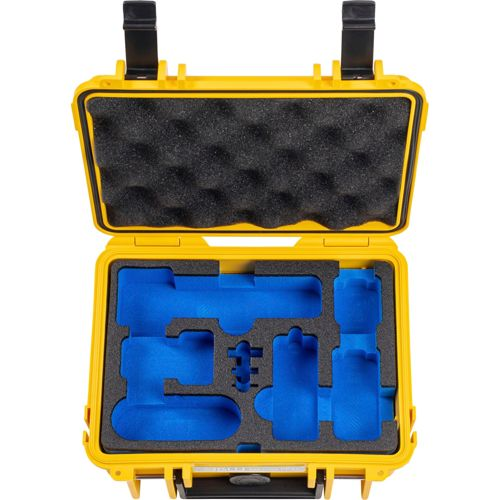 Gelber Koffer mit schwarzem und blauem Schaumstofffutter für Gegenstände.