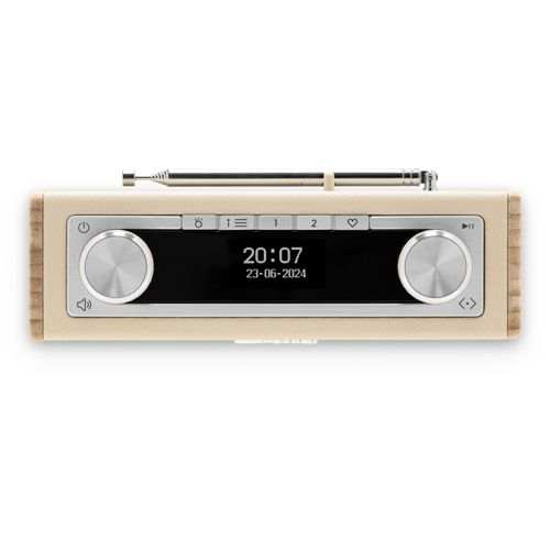 Une radio de couleur crème avec des boutons argentés et une antenne extensible.
