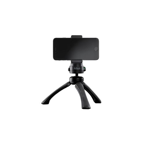 A black smartphone is mounted on a small black tripod.