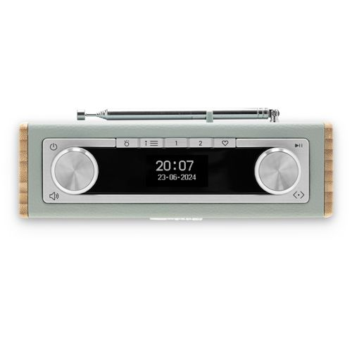 Une radio vert clair avec des boutons argentés et un écran numérique.