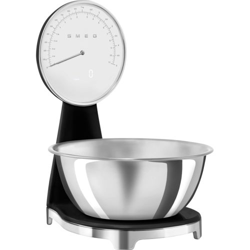 Una báscula de cocina retro negra con un bol plateado y un dial blanco.