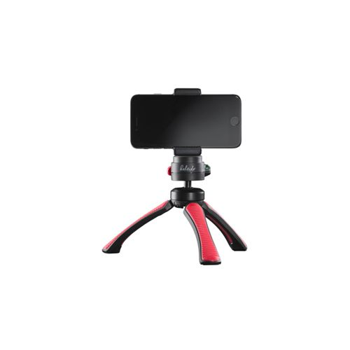 Un smartphone negro montado en un pequeño trípode rojo y negro.