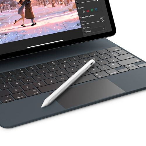 A white stylus rests on a dark keyboard with a tablet.