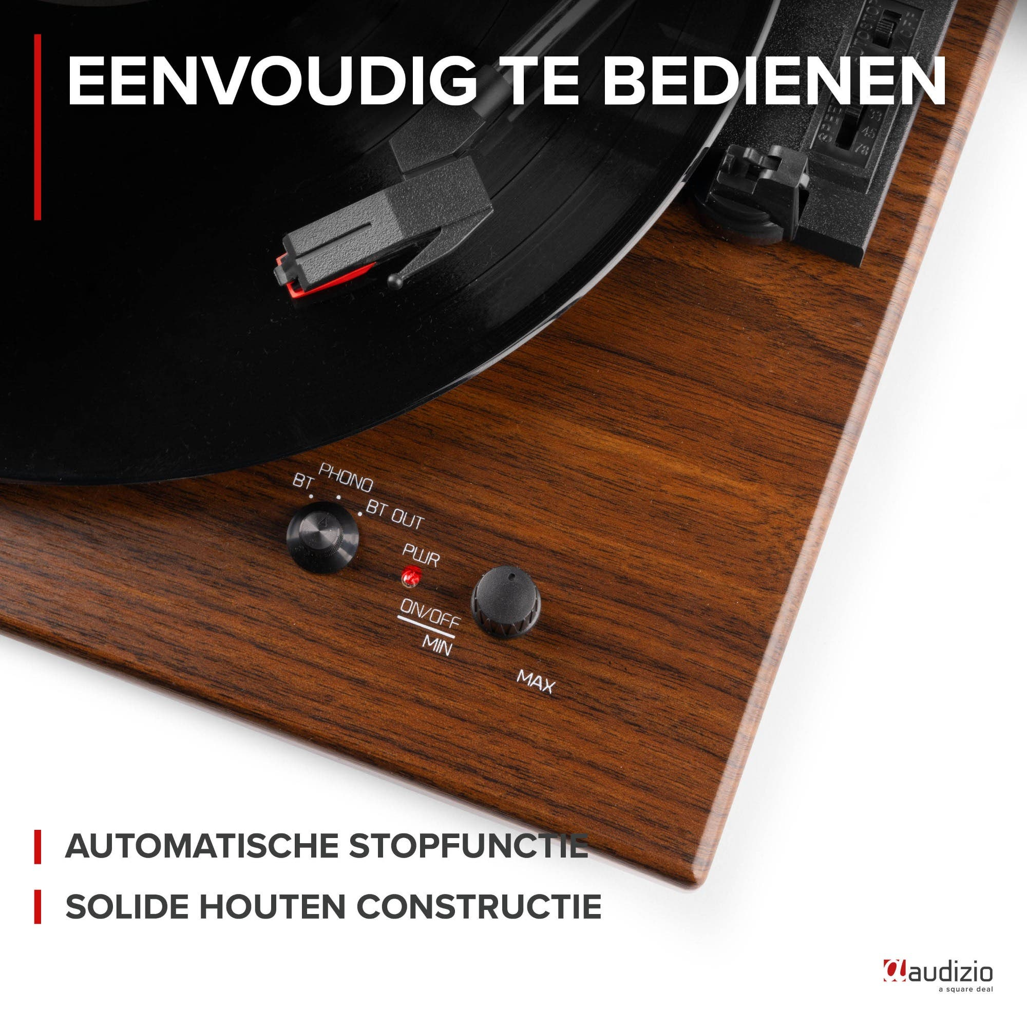 Record player with wooden casing, controls, and needle.