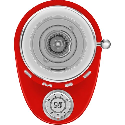 Batidora roja con buje de accesorio plateado y dial de velocidad
