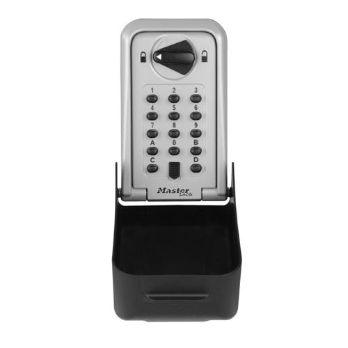 Una caja fuerte para llaves plateada con teclado numérico, dial y compartimento negro.